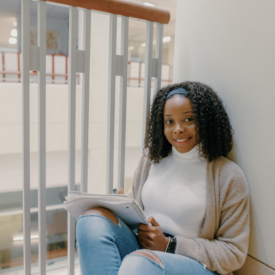 Female student sitting in campus center