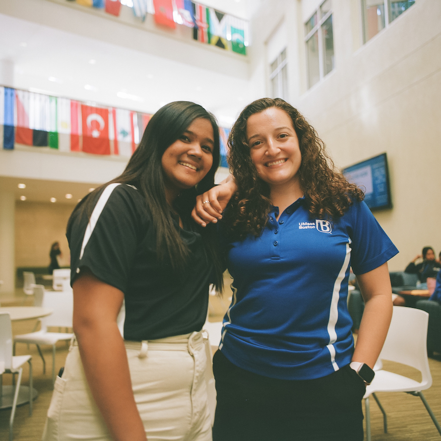 Two students smiling