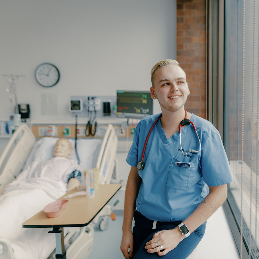 Male nursing student in nursing lab and uniform