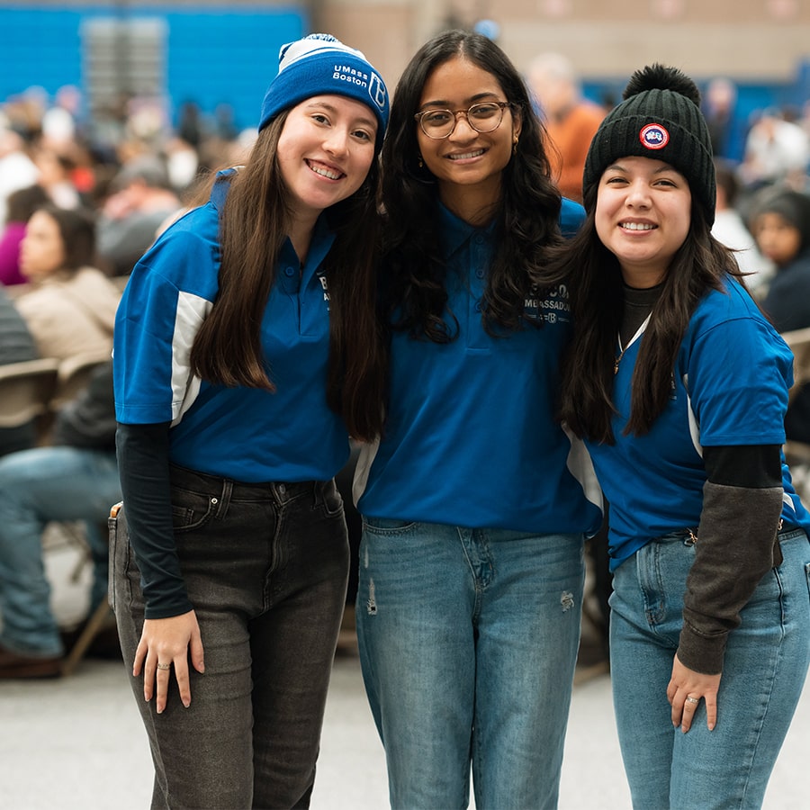 Welcome Day 3 student workers smiling in gym.